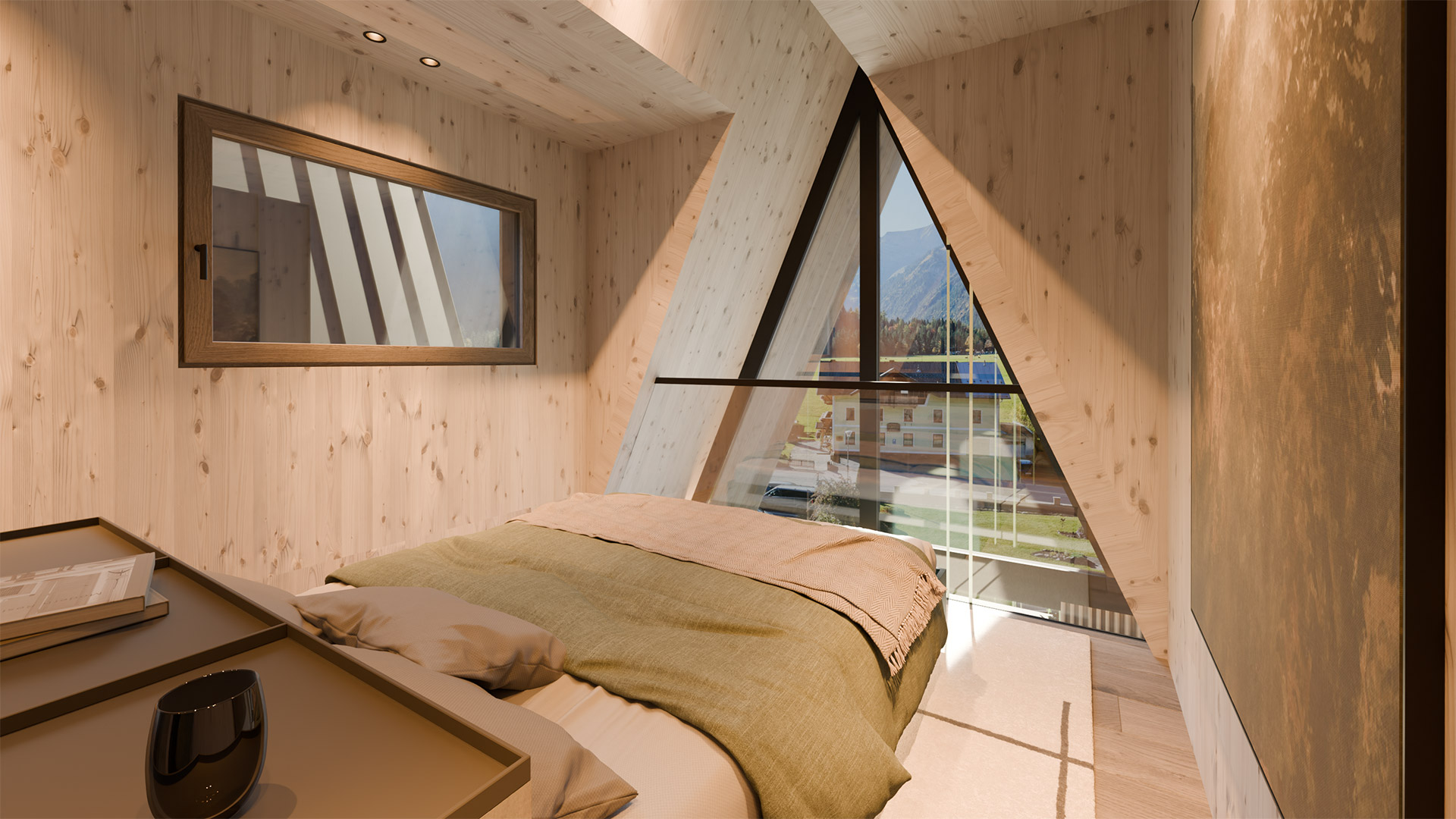 Schlafzimmer mit großem Panoramafenster und Blick auf die Alpenlandschaft am Achensee.